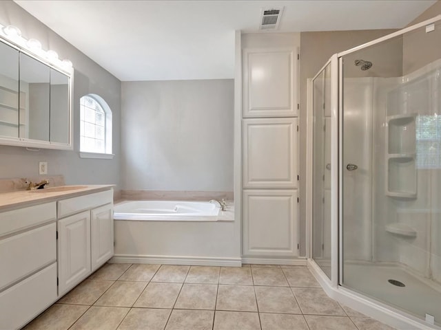 bathroom with vanity, tile patterned floors, and independent shower and bath