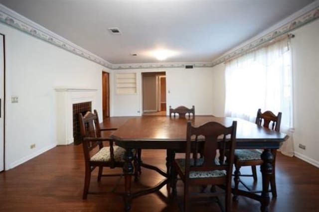 dining room with dark hardwood / wood-style flooring