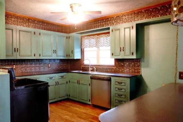 kitchen with sink, light hardwood / wood-style flooring, stainless steel dishwasher, ceiling fan, and tasteful backsplash