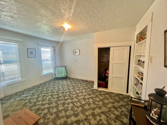 interior space with a textured ceiling