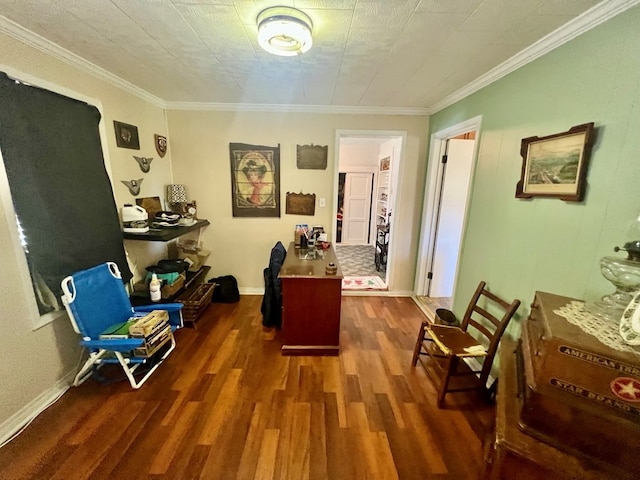 sitting room featuring dark hardwood / wood-style flooring and crown molding