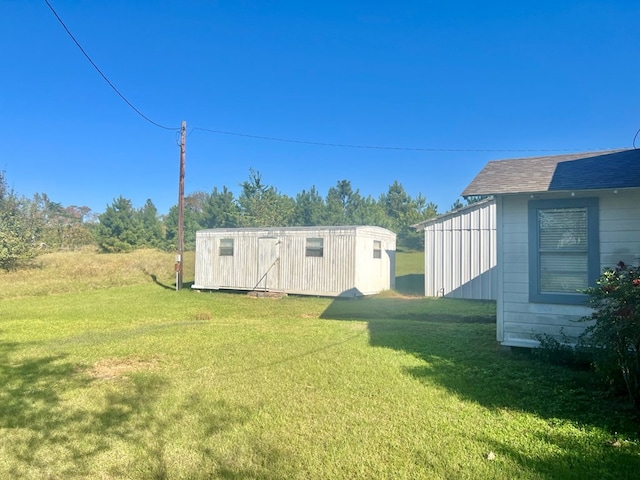 view of yard with a storage shed