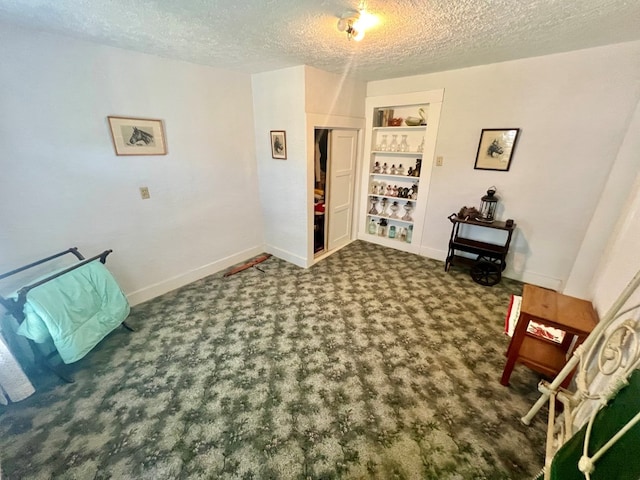 unfurnished room featuring a textured ceiling