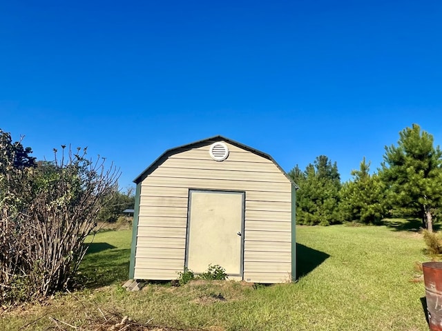 view of outdoor structure with a lawn