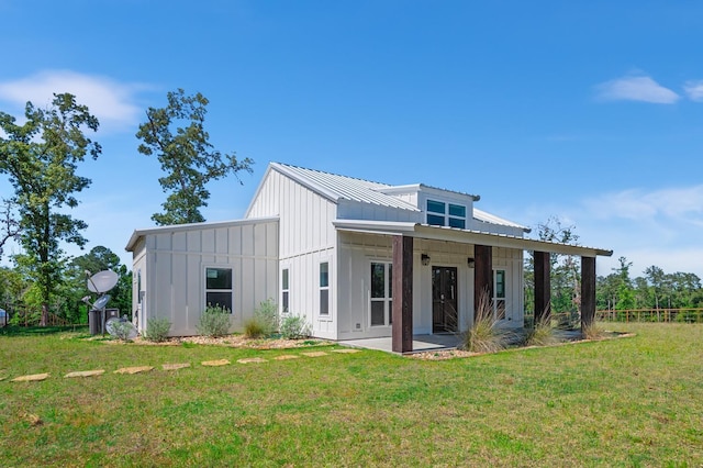 view of front facade with a patio area and a front lawn