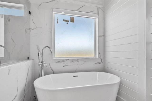 bathroom with a washtub