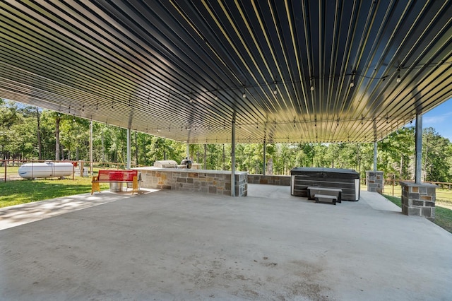 view of patio / terrace with a hot tub