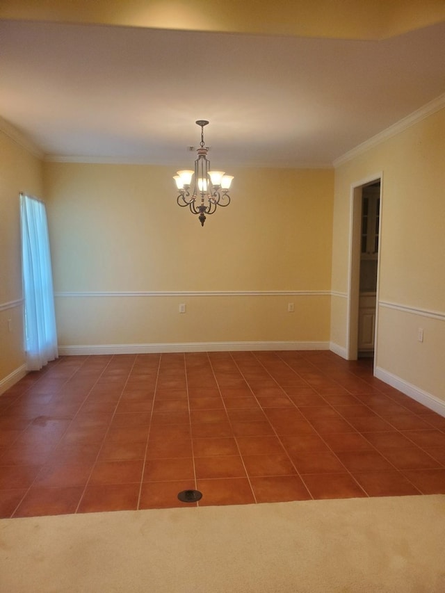 empty room featuring ornamental molding, tile patterned floors, and a notable chandelier