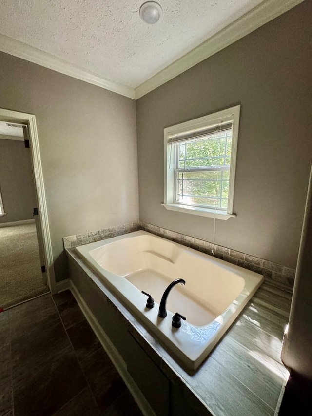 2505 County Road 4420, Spurger, TX 77660 - full bath featuring ornamental molding, a garden tub, and a textured ceiling