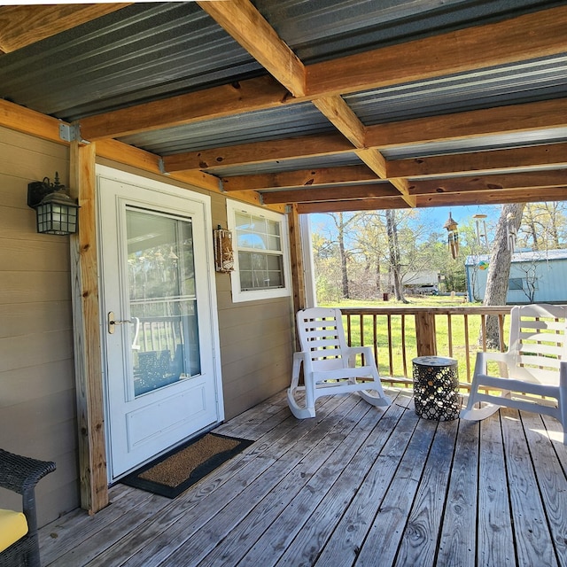 wooden terrace featuring covered porch
