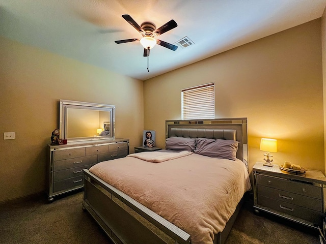 bedroom with ceiling fan, dark colored carpet, and visible vents