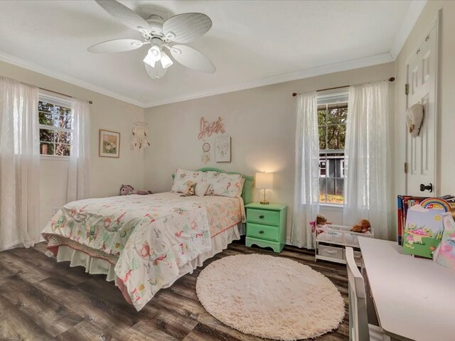 bedroom featuring ceiling fan, dark hardwood / wood-style flooring, and crown molding