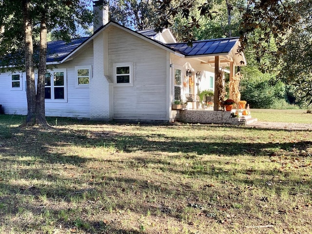 view of home's exterior with a yard