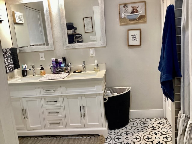 bathroom featuring tile patterned flooring and vanity