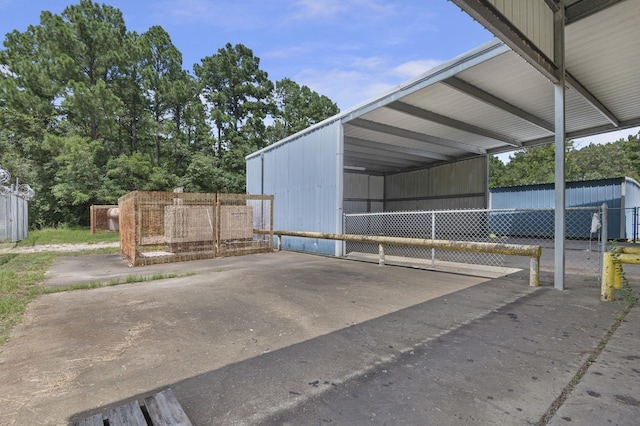 view of vehicle parking with a carport