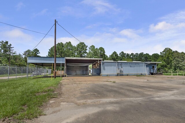 view of front of property with a carport