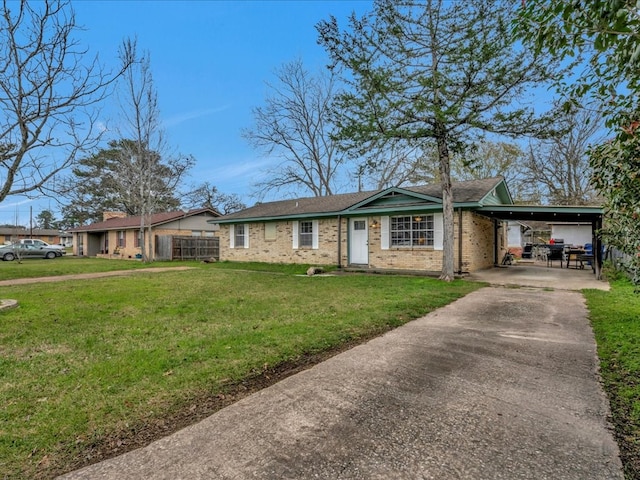 ranch-style house featuring a front lawn and a carport