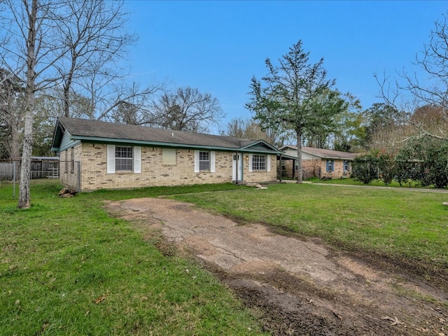 ranch-style house featuring a front lawn