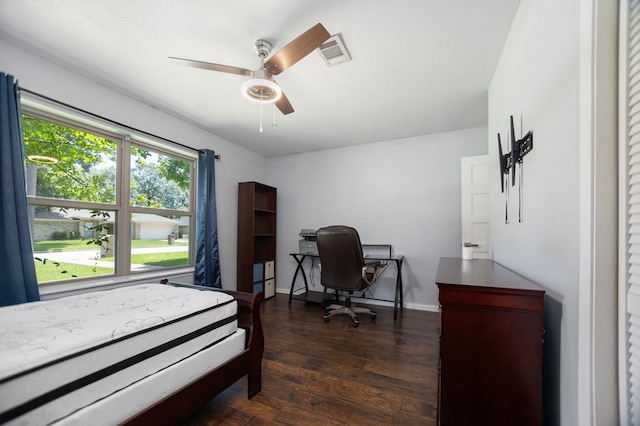 206 Spyglass Dr, Lufkin, TX 75901 - bedroom with dark wood-style floors, a ceiling fan, and a desk