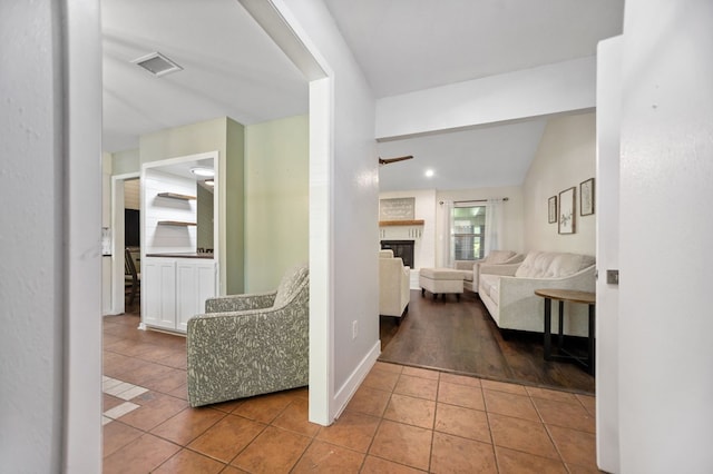 206 Spyglass Dr, Lufkin, TX 75901 - corridor featuring tile patterned floors, lofted ceiling, and recessed lighting