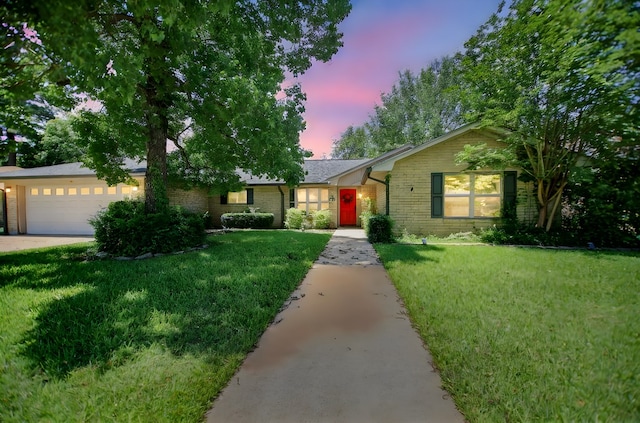 206 Spyglass Dr, Lufkin, TX 75901 - ranch-style home with an attached garage, a yard, brick siding, and driveway