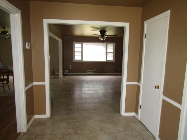 hallway with light tile patterned floors