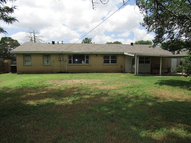 back of property with a yard