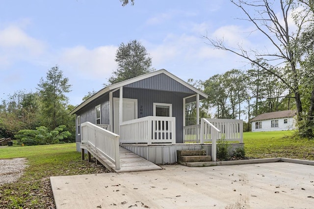 exterior space featuring a porch and a front yard