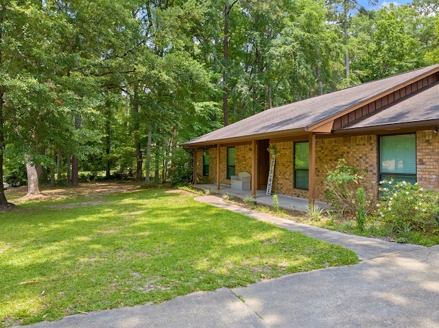 920 Richardson Dr, Jasper, TX 75951 - view of green lawn with a porch