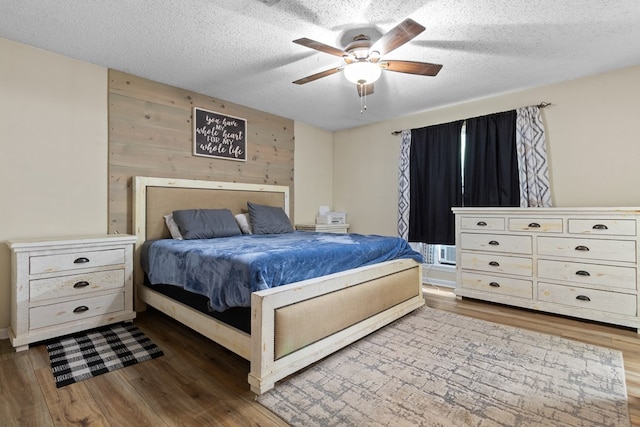 920 Richardson Dr, Jasper, TX 75951 - bedroom with wood finished floors, a textured ceiling, and a ceiling fan