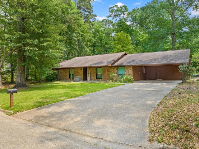 920 Richardson Dr, Jasper, TX 75951 - ranch-style house featuring concrete driveway, a front lawn, and an attached carport