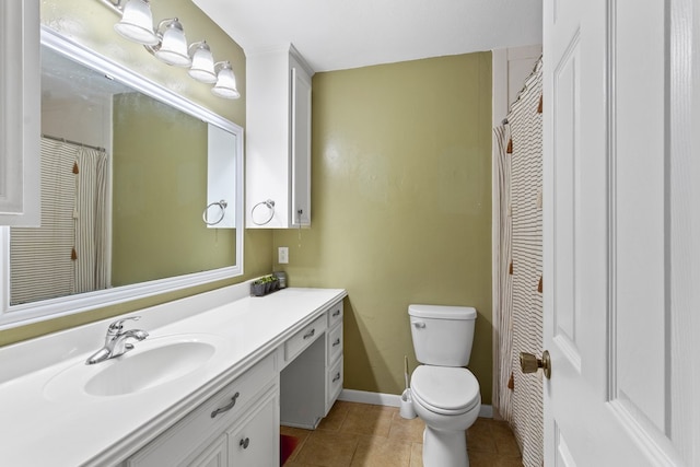 920 Richardson Dr, Jasper, TX 75951 - full bath with vanity, toilet, tile patterned floors, and baseboards
