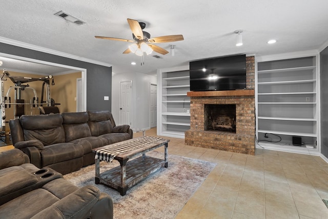 920 Richardson Dr, Jasper, TX 75951 - living room with built in shelves, ceiling fan, a textured ceiling, a fireplace, and tile patterned floors