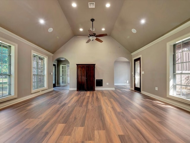 unfurnished living room with dark hardwood / wood-style floors, high vaulted ceiling, ceiling fan, and crown molding