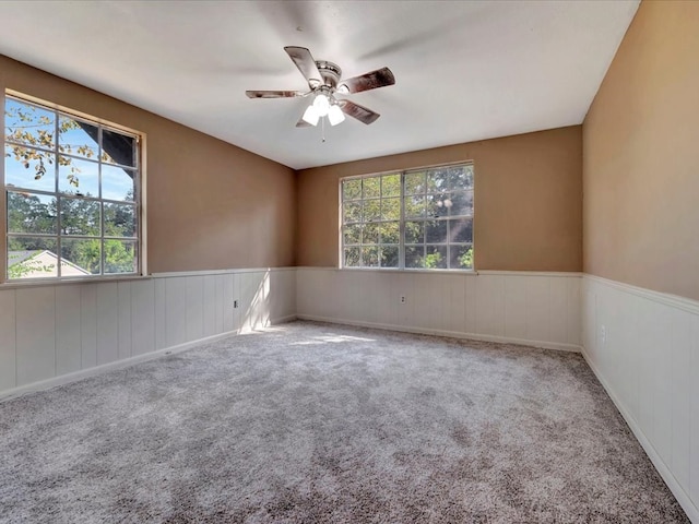 unfurnished room featuring carpet flooring and ceiling fan