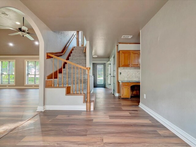 entrance foyer with hardwood / wood-style floors and ceiling fan