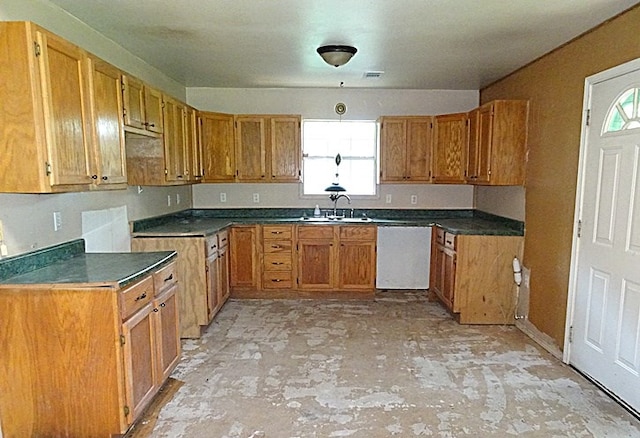 kitchen featuring plenty of natural light, dishwasher, and sink