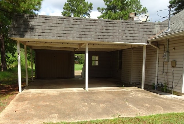 view of parking / parking lot with a carport