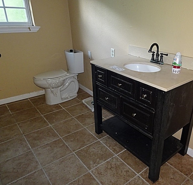 bathroom with tile patterned floors, vanity, and toilet