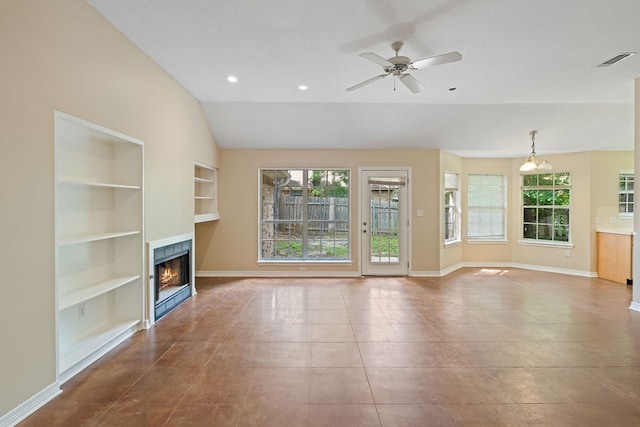 19 Windsor Ct, Lufkin, TX 75901 - unfurnished living room featuring built in features, a warm lit fireplace, a ceiling fan, lofted ceiling, and recessed lighting