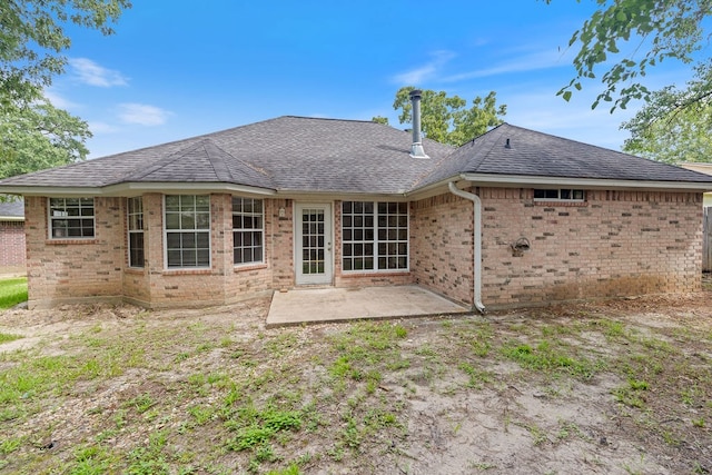 19 Windsor Ct, Lufkin, TX 75901 - back of house with brick siding, a shingled roof, and a patio area