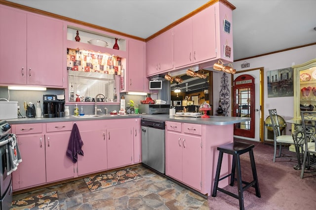 kitchen featuring sink, crown molding, a breakfast bar area, appliances with stainless steel finishes, and kitchen peninsula