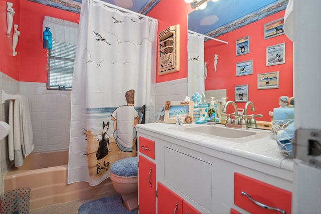 full bathroom featuring vanity, tile walls, shower / bathtub combination with curtain, and toilet