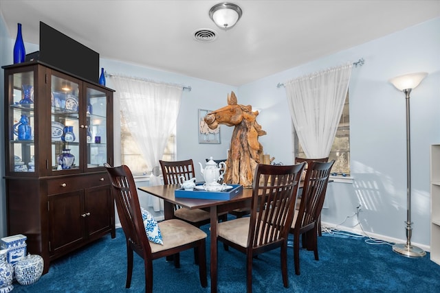 view of carpeted dining area