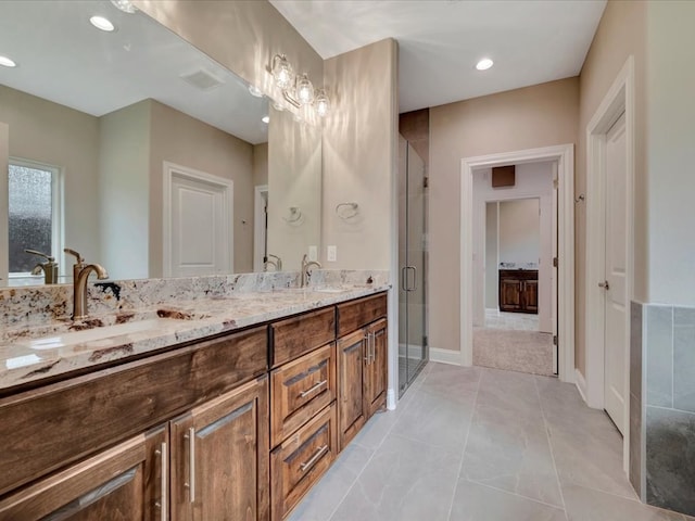 bathroom featuring vanity and walk in shower