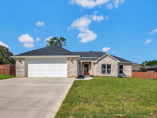 single story home with a front yard and a garage