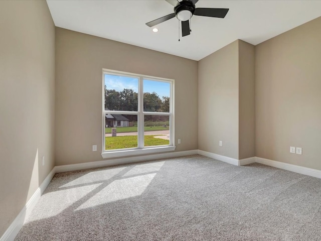 carpeted empty room with ceiling fan