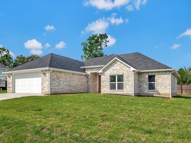 view of front of property featuring a garage and a front lawn