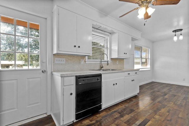 kitchen featuring light countertops, black dishwasher, dark wood-style flooring, and a sink