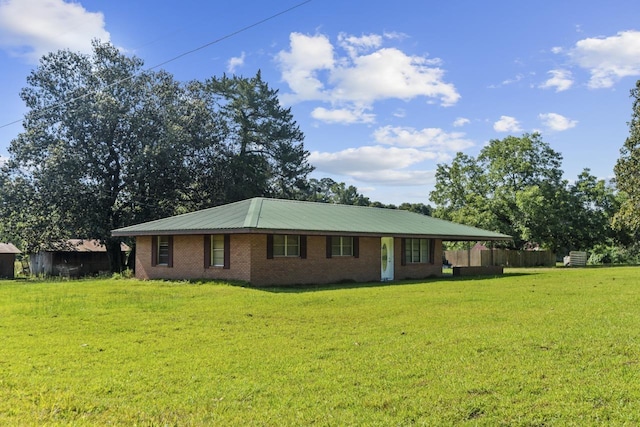 ranch-style house with brick siding and a front lawn
